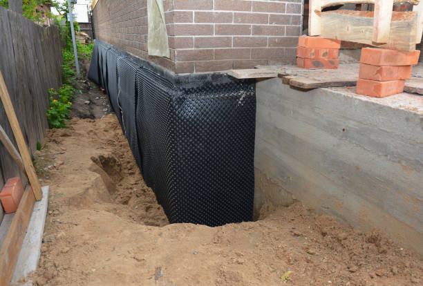 SJ Waterproofing Pros technician performing targeted Vapor Barrier Installation assessment in Taylor, MI
